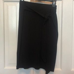 Black knee length skirt that ties at waist. High slit. Express. Size 10